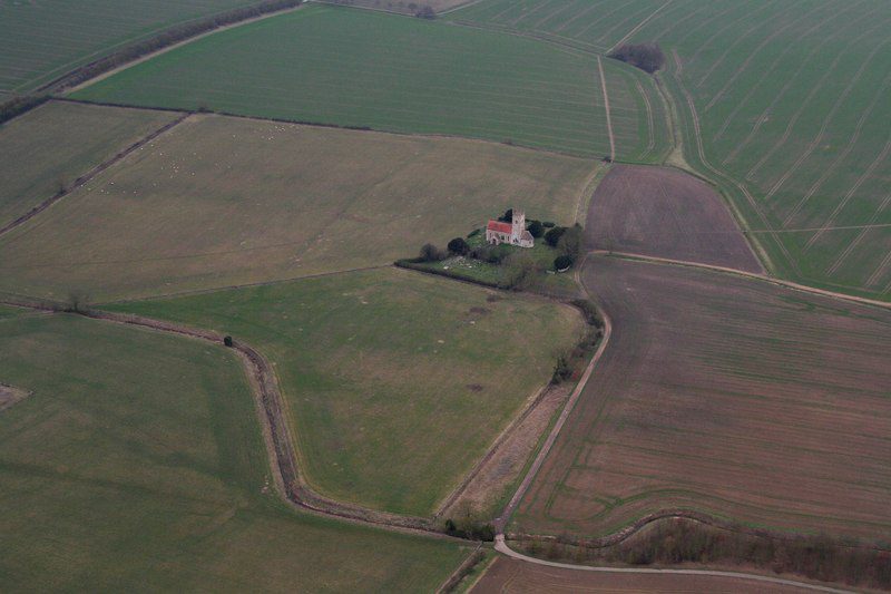 Arial photograph of St Andrews Church and priory site, surrounded by fields